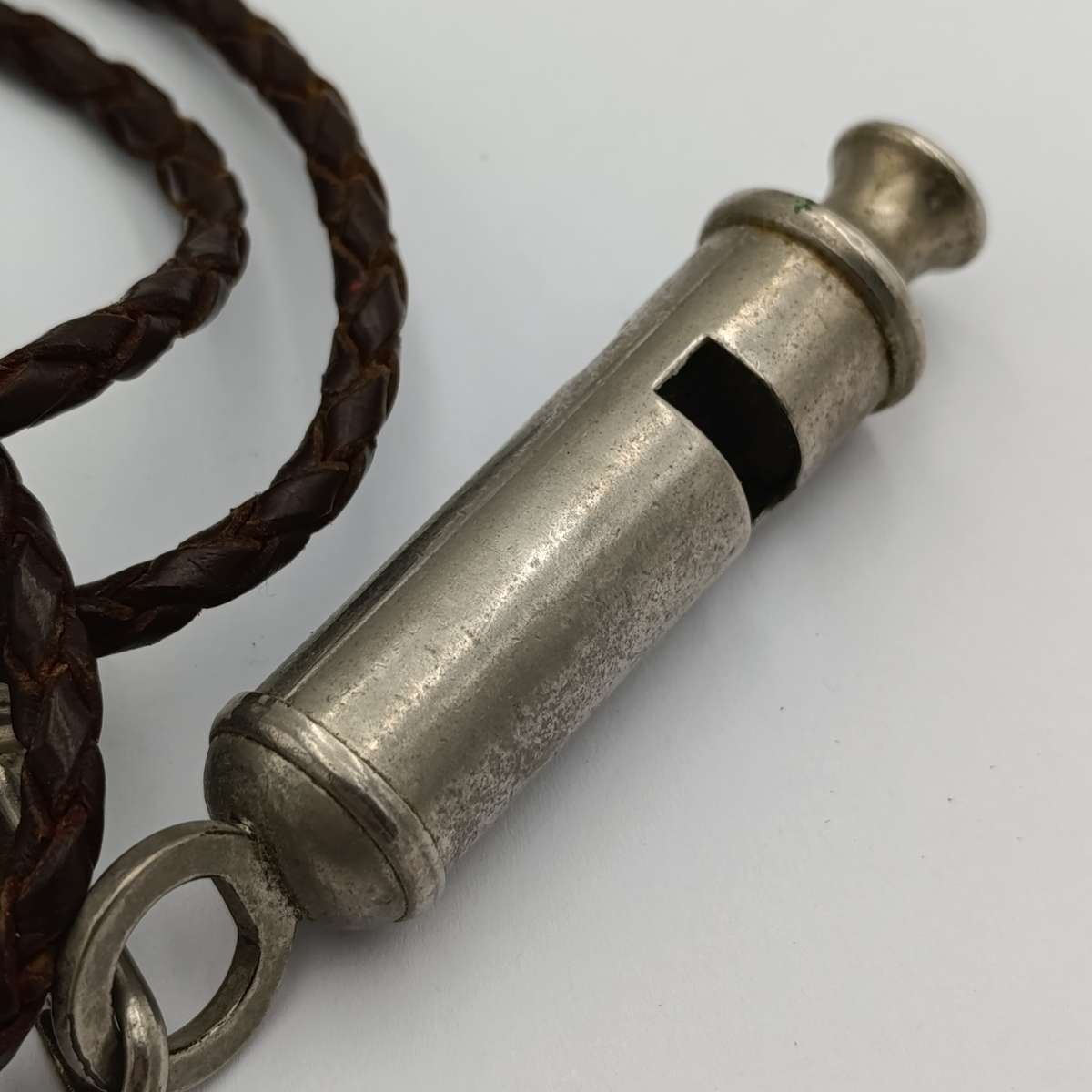 The ACME city police whistle with leather lanyard