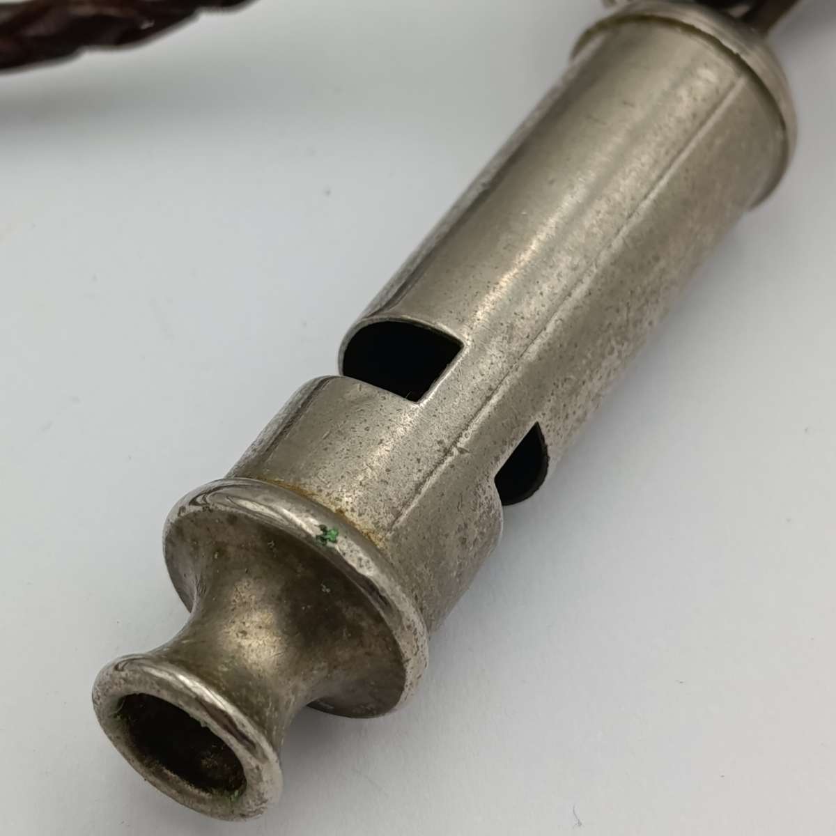 The ACME city police whistle with leather lanyard