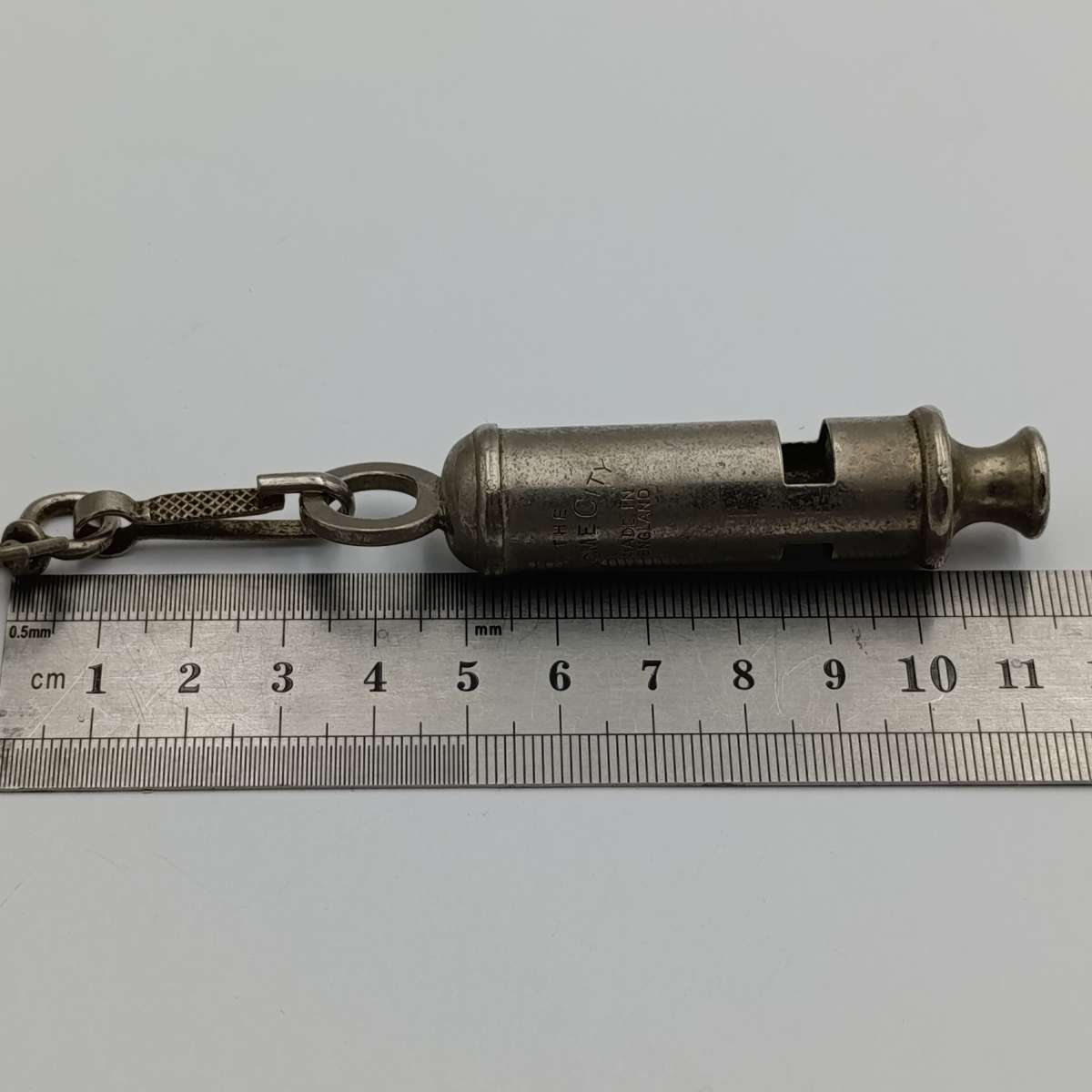 The ACME city police whistle with leather lanyard
