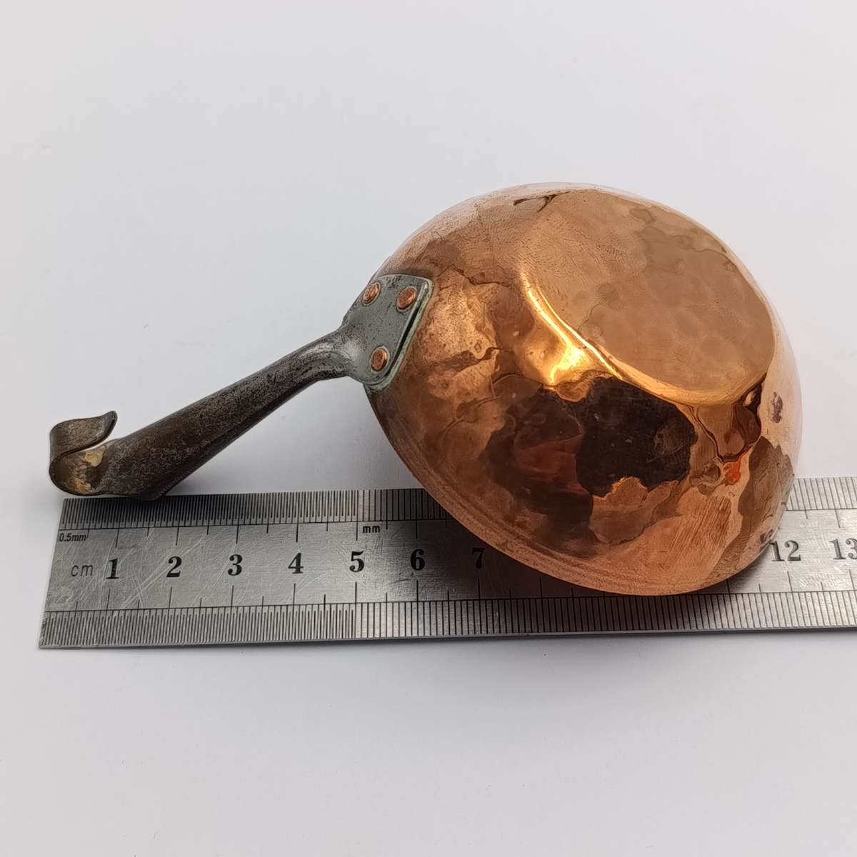 Antique Norwegian hammered copper measuring spoon