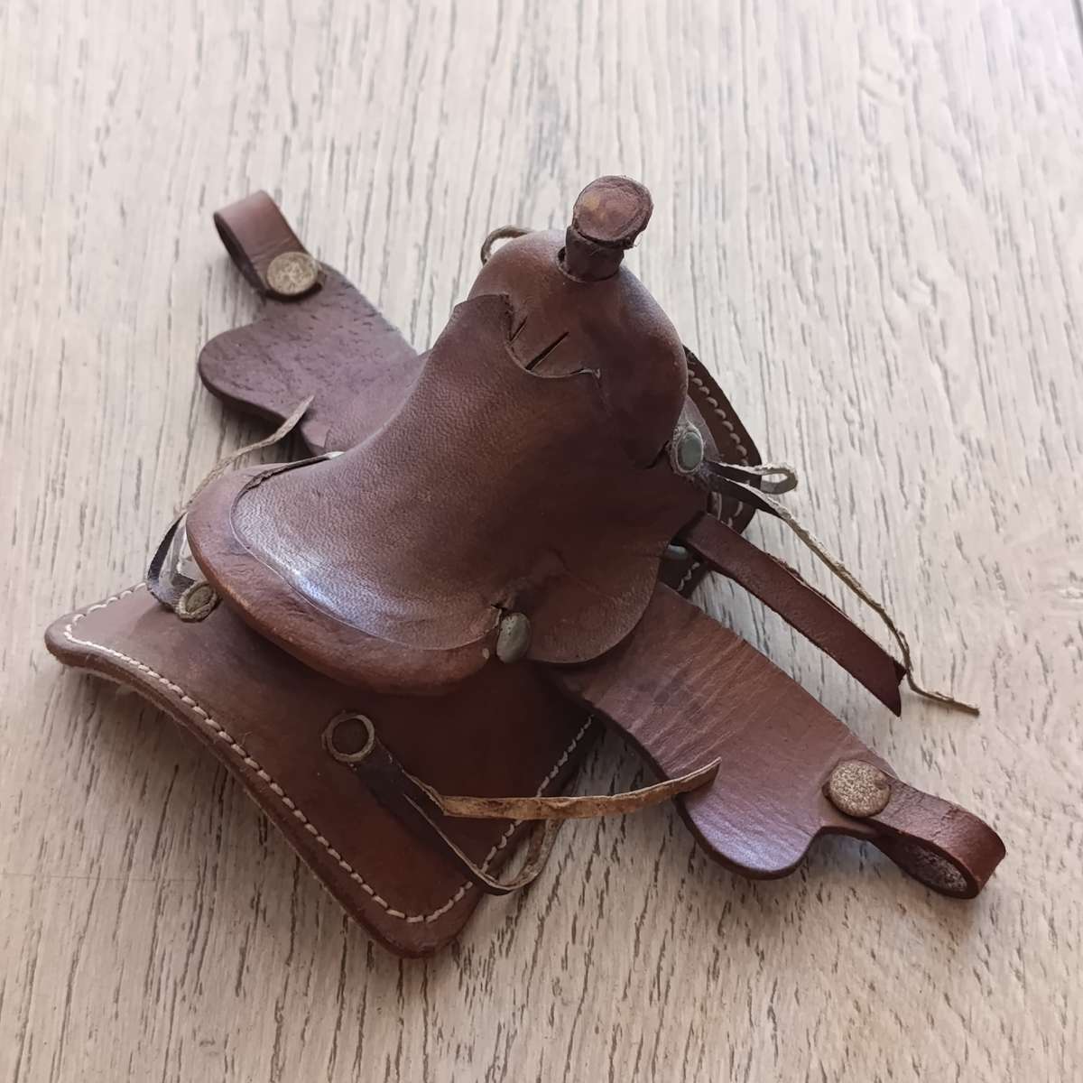 Miniature leather horse saddle