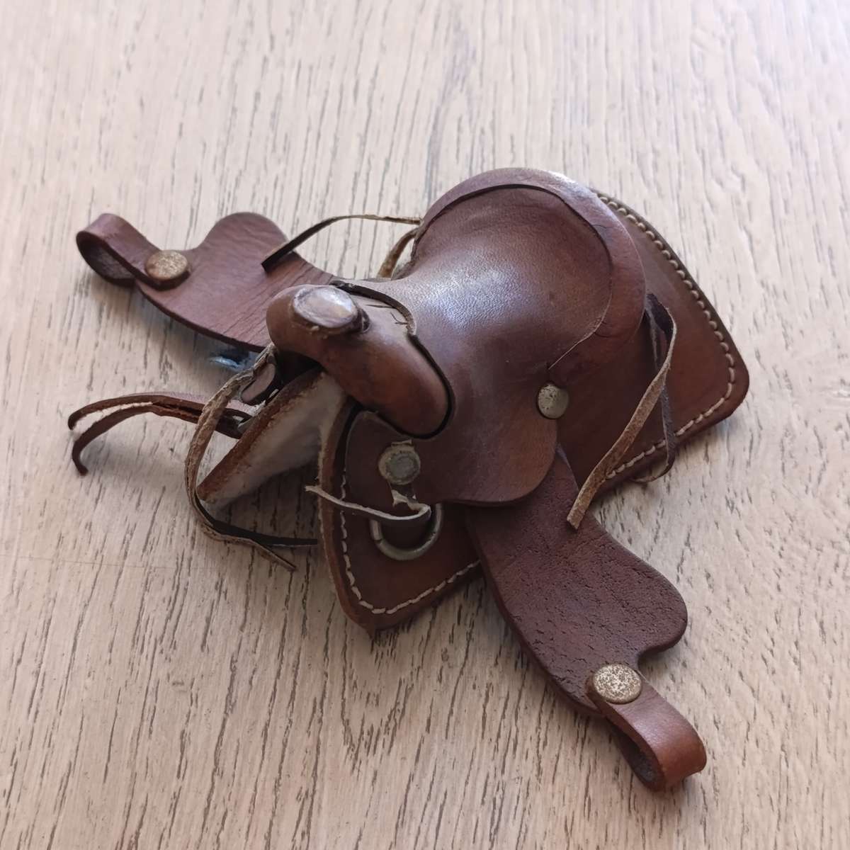 Miniature leather horse saddle