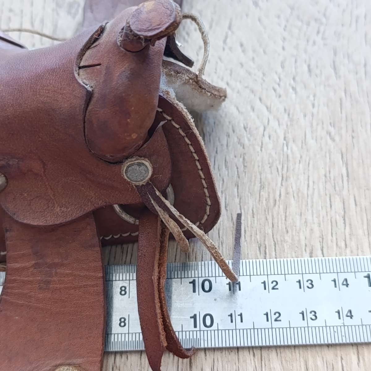 Miniature leather horse saddle