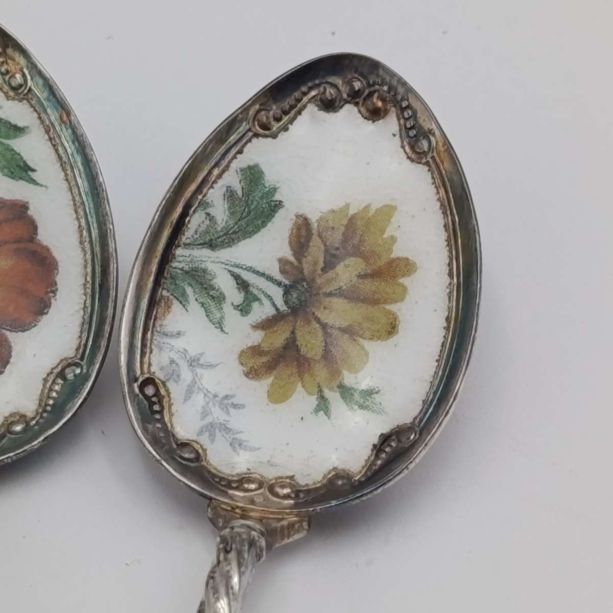Set of 6 silverplated teaspoons with porcelain flower inlay design