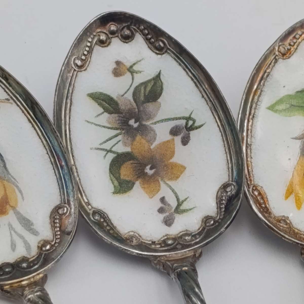 Set of 6 silverplated teaspoons with porcelain flower inlay design