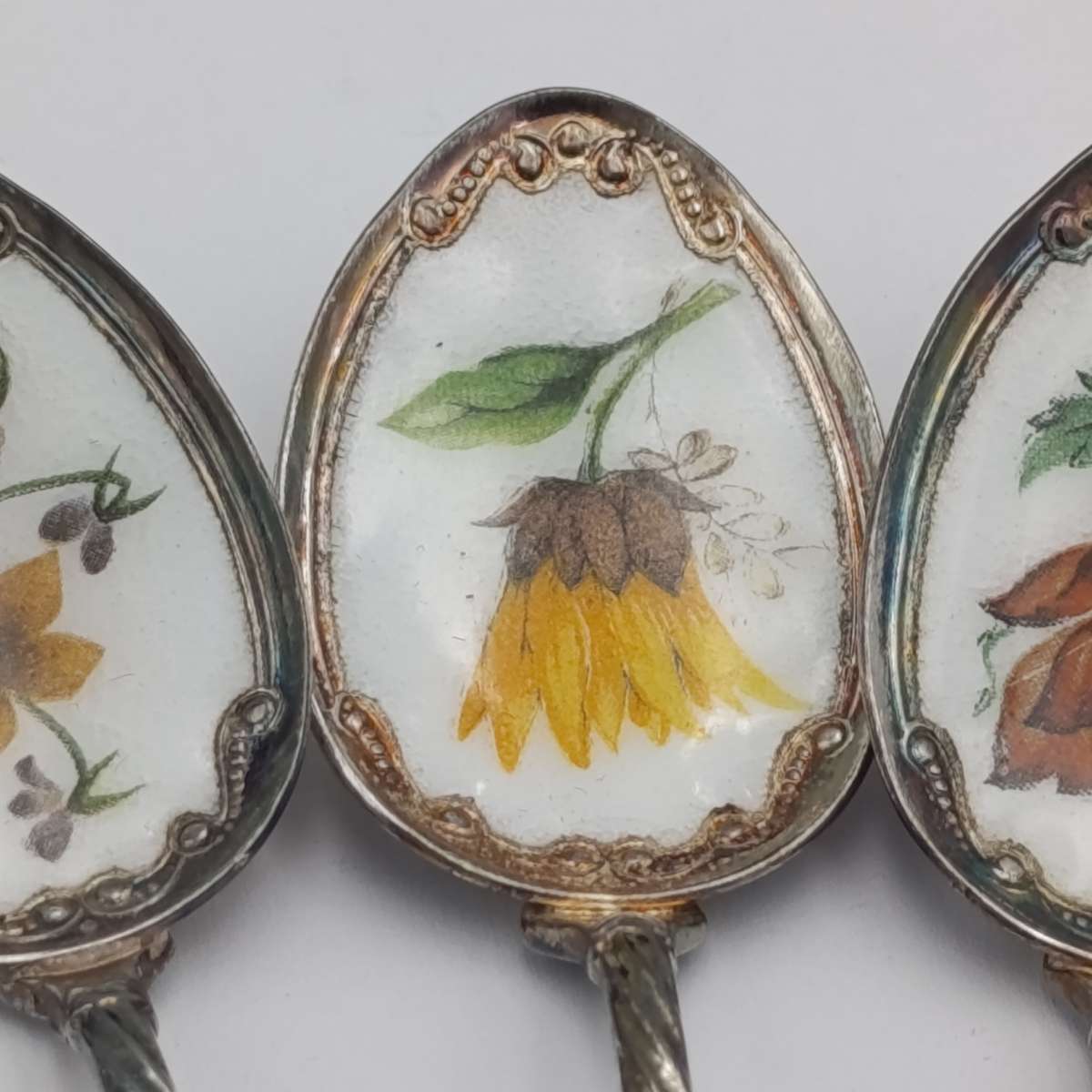 Set of 6 silverplated teaspoons with porcelain flower inlay design
