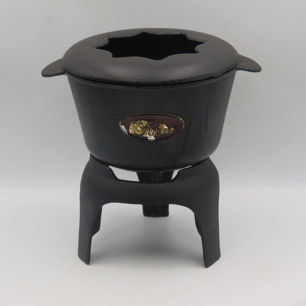 Vintage cast-iron fondue set with 8 forks
