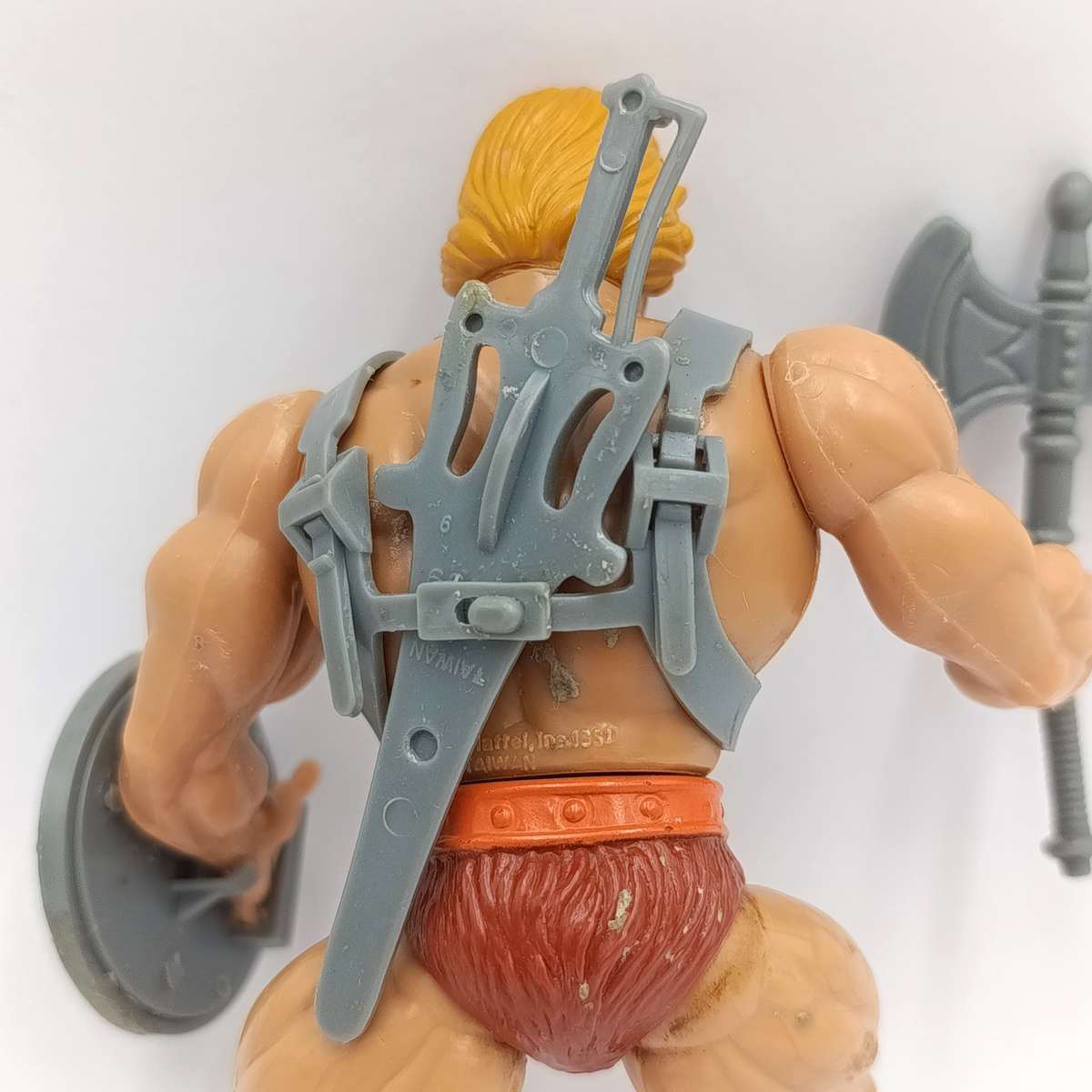 Vintage Masters of the Universe He-Man figurine with weapons and accessories