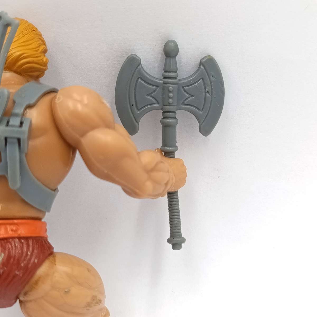 Vintage Masters of the Universe He-Man figurine with weapons and accessories