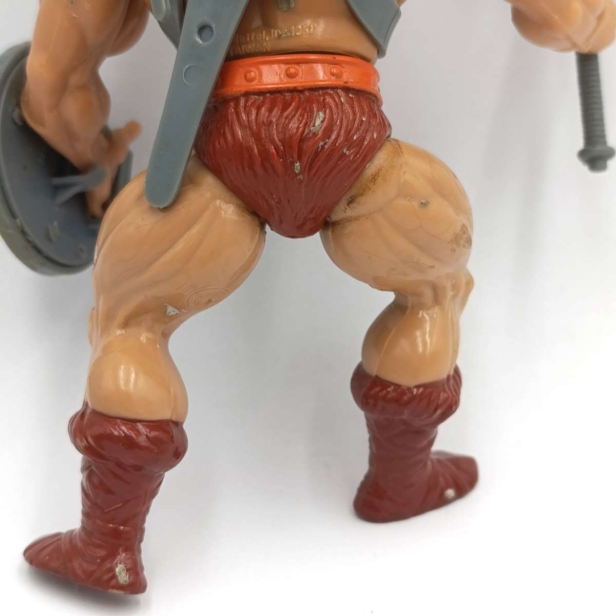 Vintage Masters of the Universe He-Man figurine with weapons and accessories