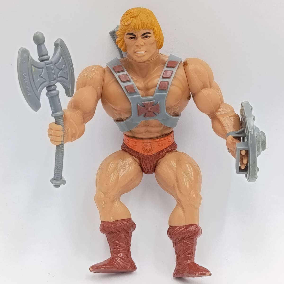 Vintage Masters of the Universe He-Man figurine with weapons and accessories
