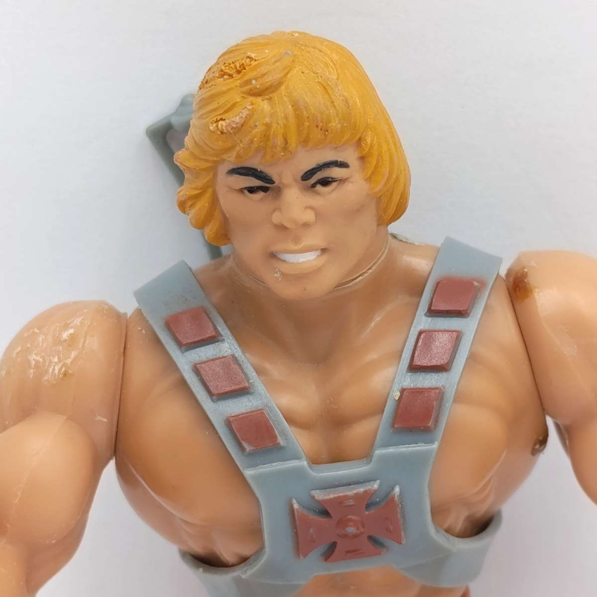 Vintage Masters of the Universe He-Man figurine with weapons and accessories