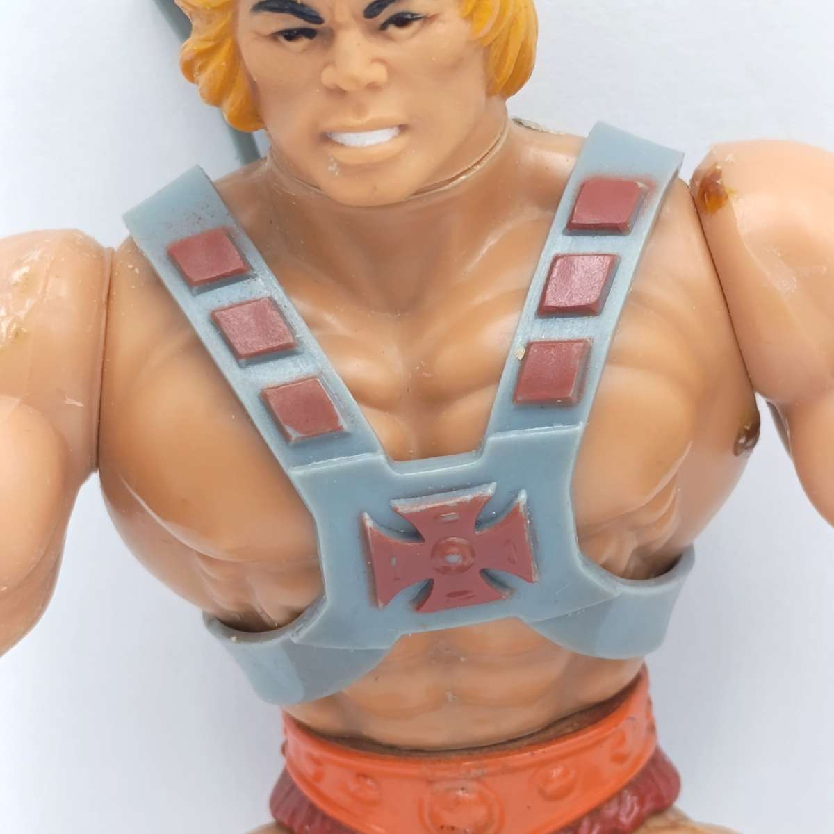 Vintage Masters of the Universe He-Man figurine with weapons and accessories