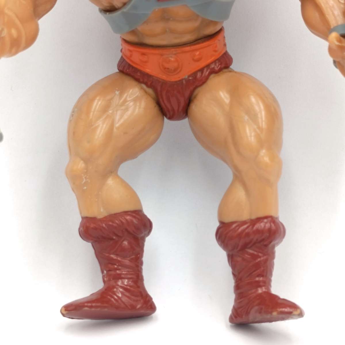 Vintage Masters of the Universe He-Man figurine with weapons and accessories