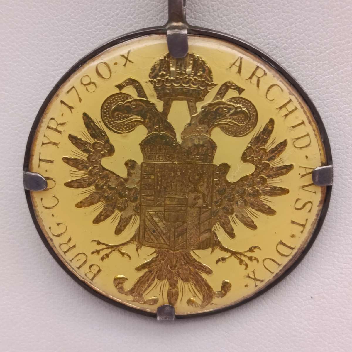 1780 Silver Maria Theresia Thaler Goldplated and epoxy in silver surround - with silver chair