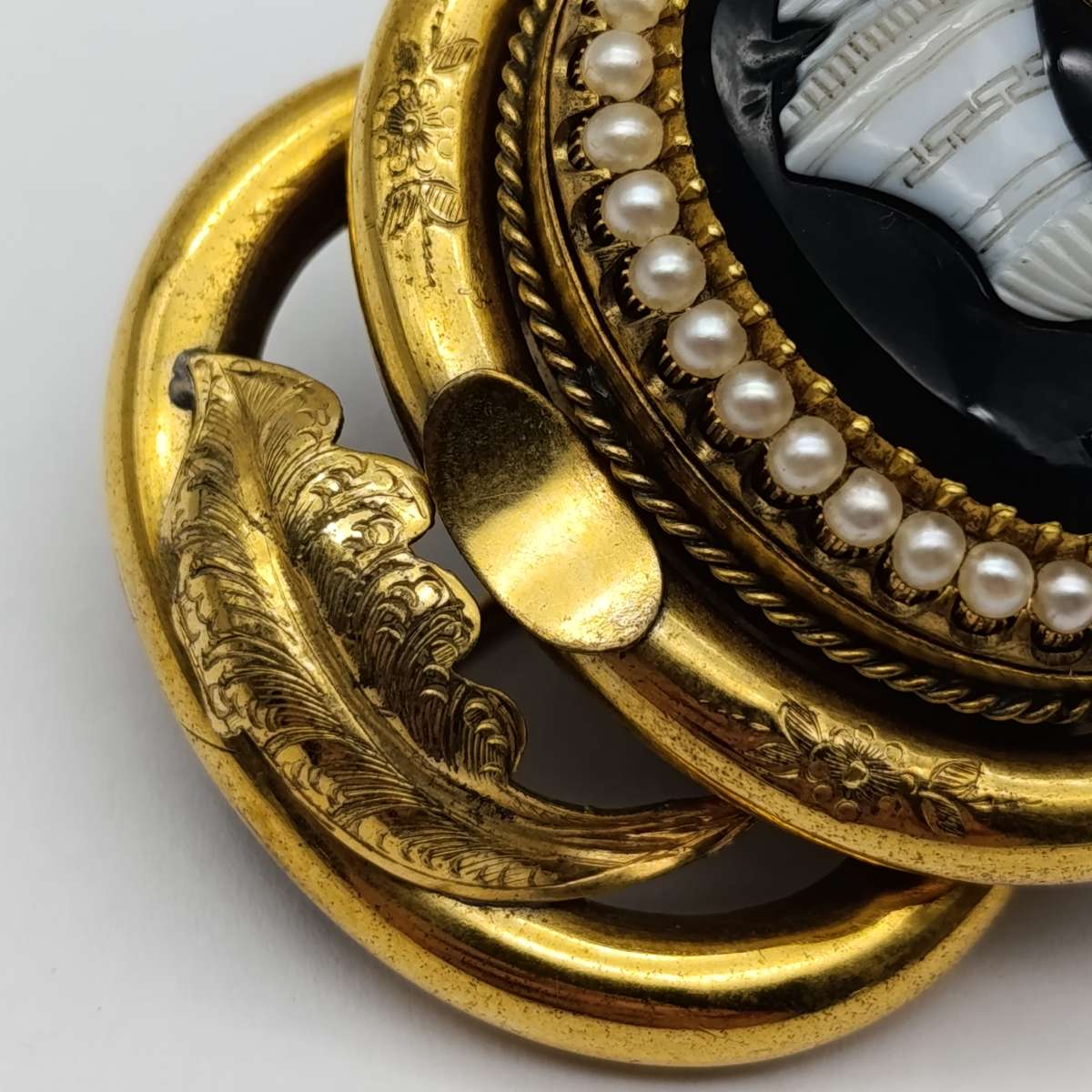 Antique low grade gold  mourning brooch with hair locket on back and safety chain