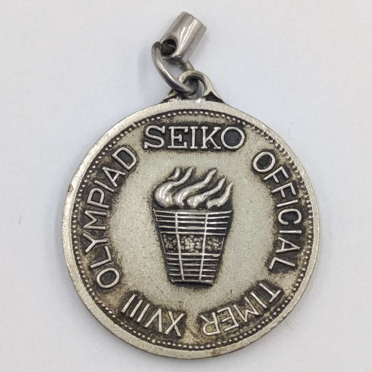 Seiko Kegving round - Official 18th Olympiad timekeeper