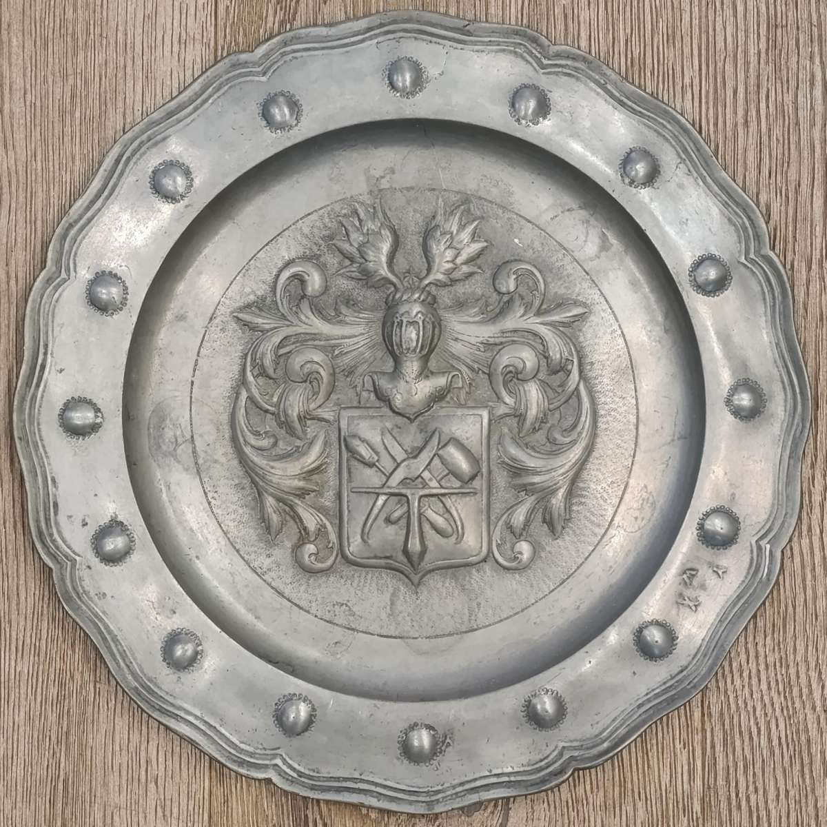 Antique English pewter plate with coat of arms