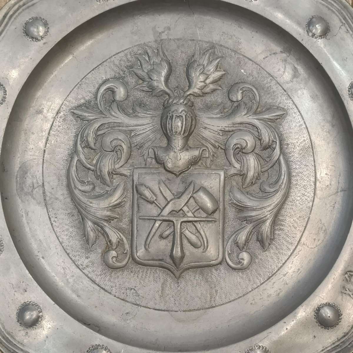 Antique English pewter plate with coat of arms