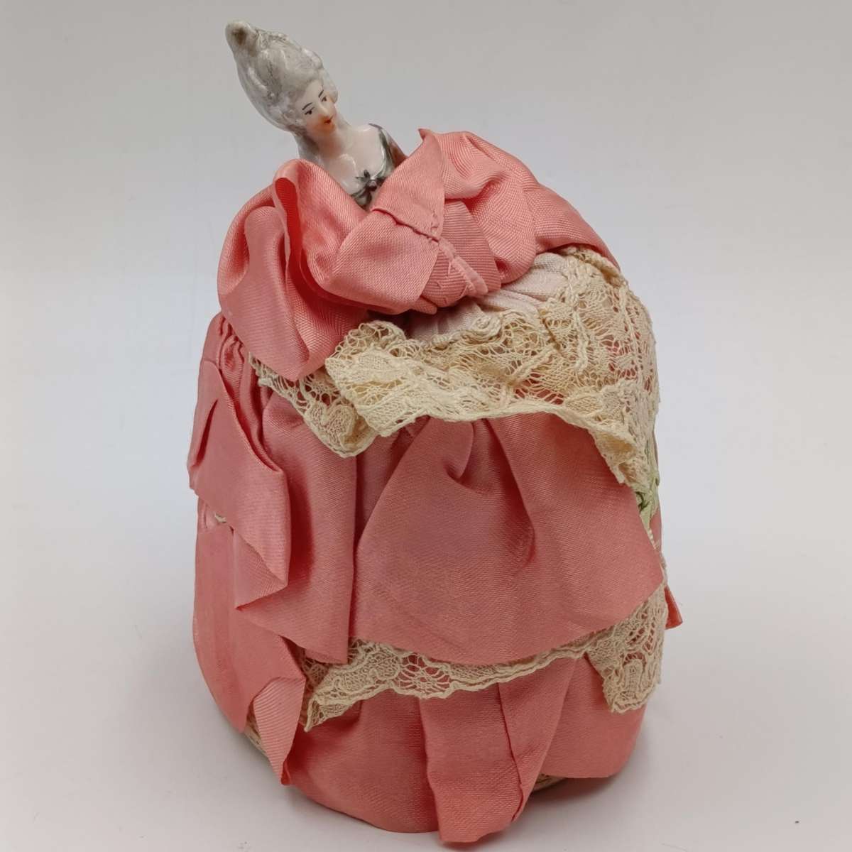Antique porcelain doll needle cushion