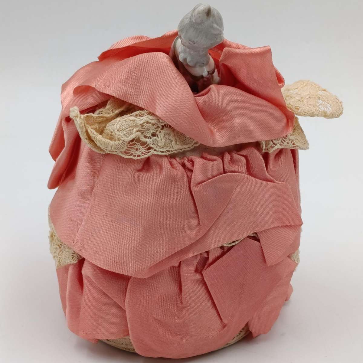 Antique porcelain doll needle cushion