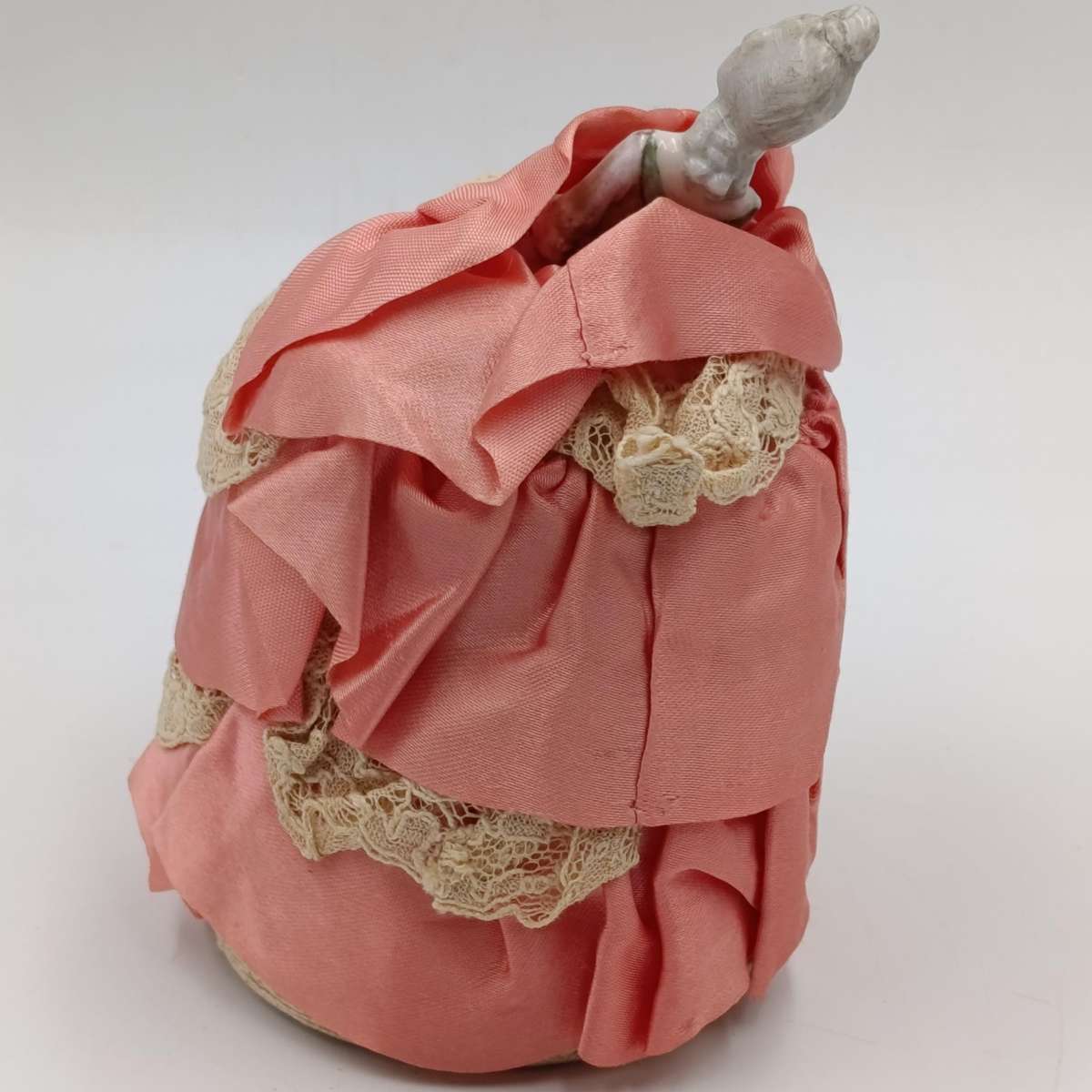 Antique porcelain doll needle cushion