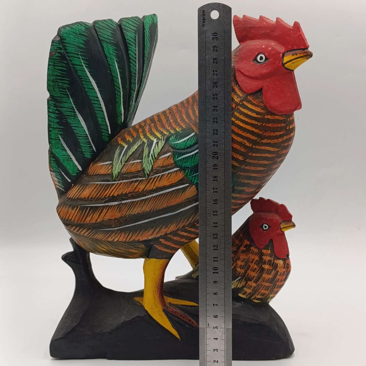 Beautiful wooden carved rooster with chick