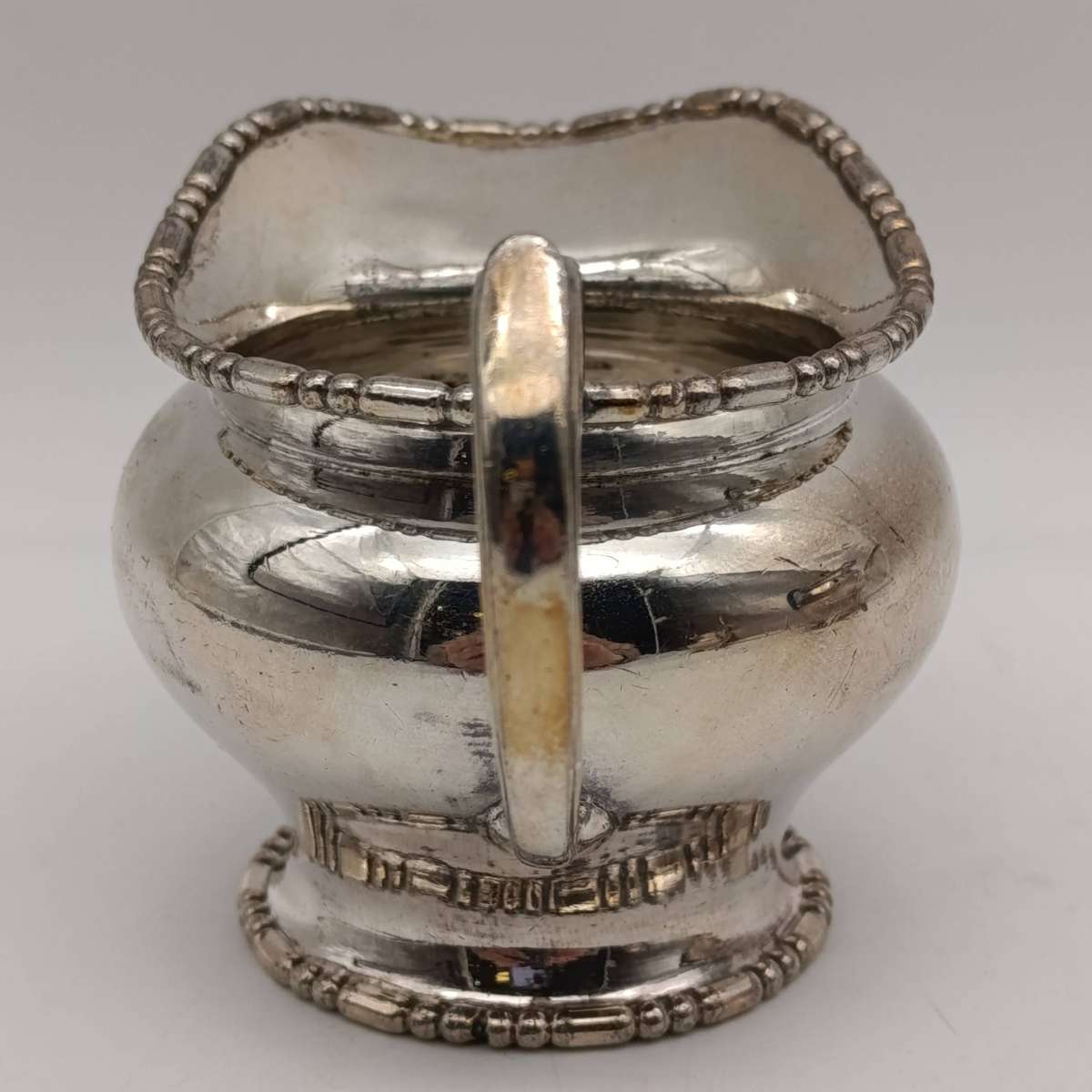 Antique Silverplated tea set - tea pot, milk jug and sugar bowl - handle repaired