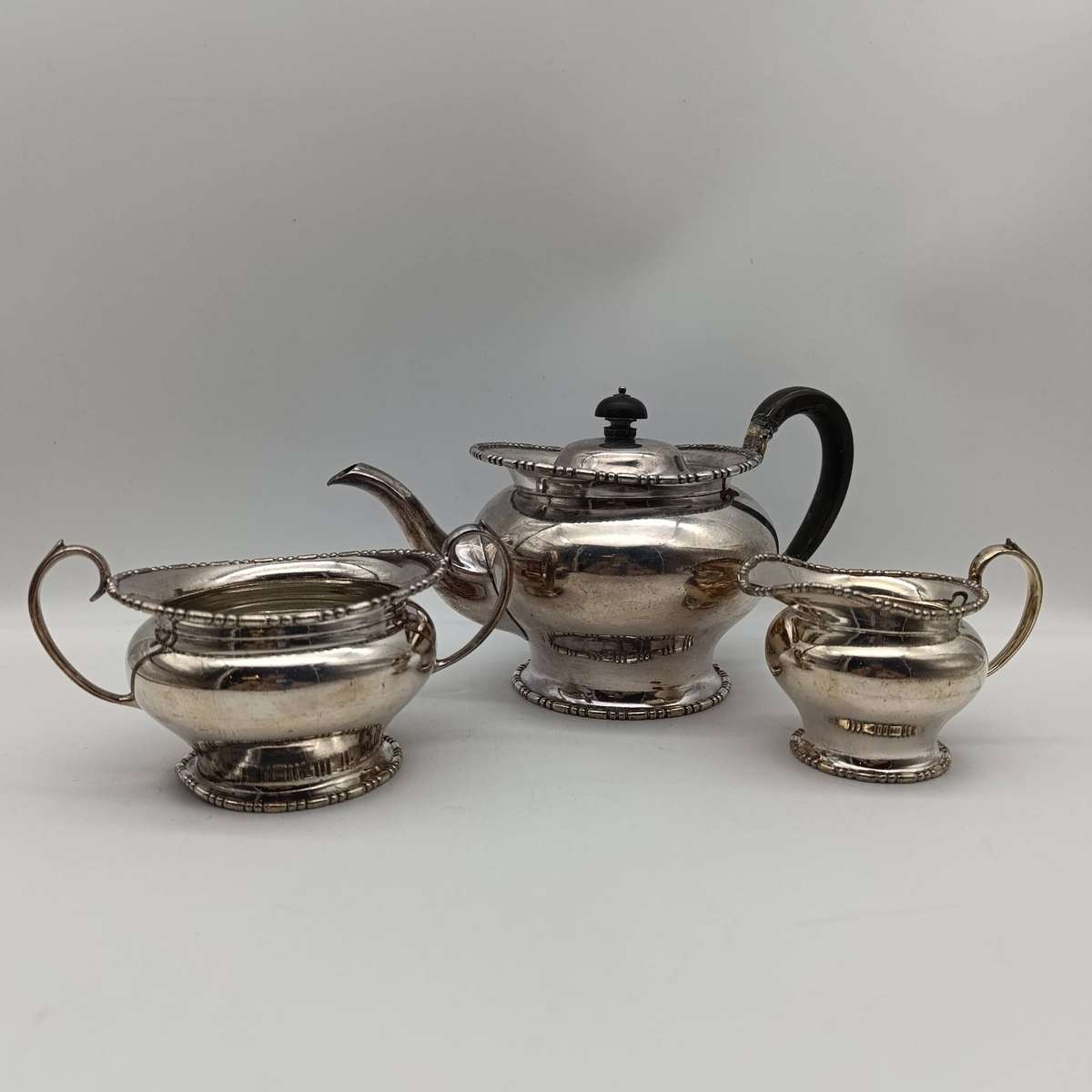 Antique Silverplated tea set - tea pot, milk jug and sugar bowl - handle repaired