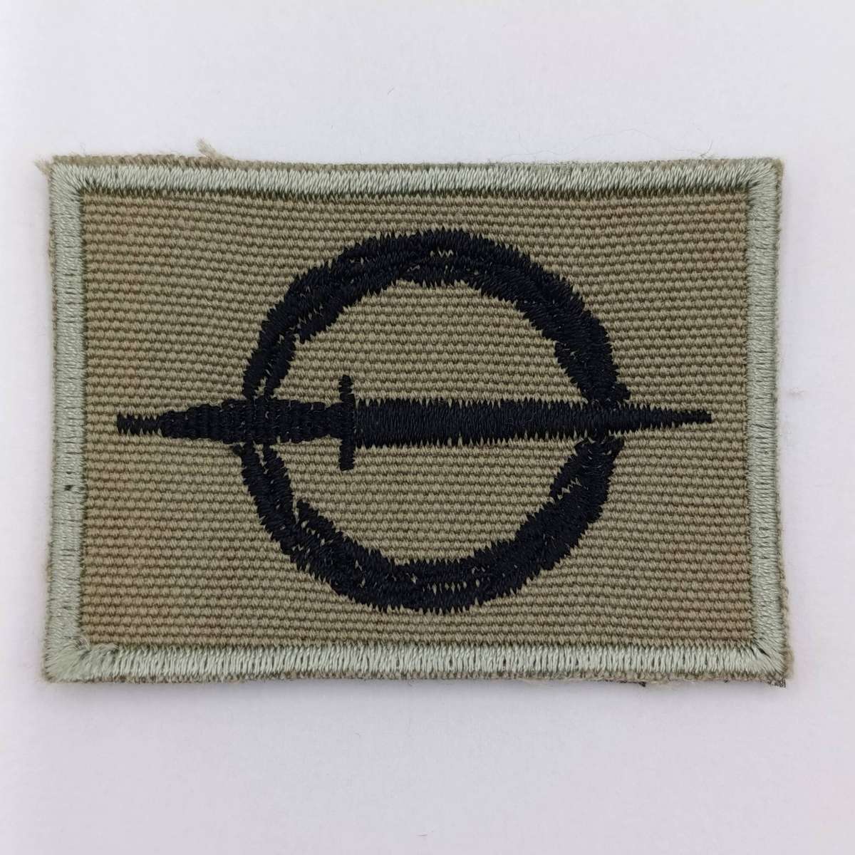 SANDF Special Forces Operator cloth badge with piece of Maroon stable belt material