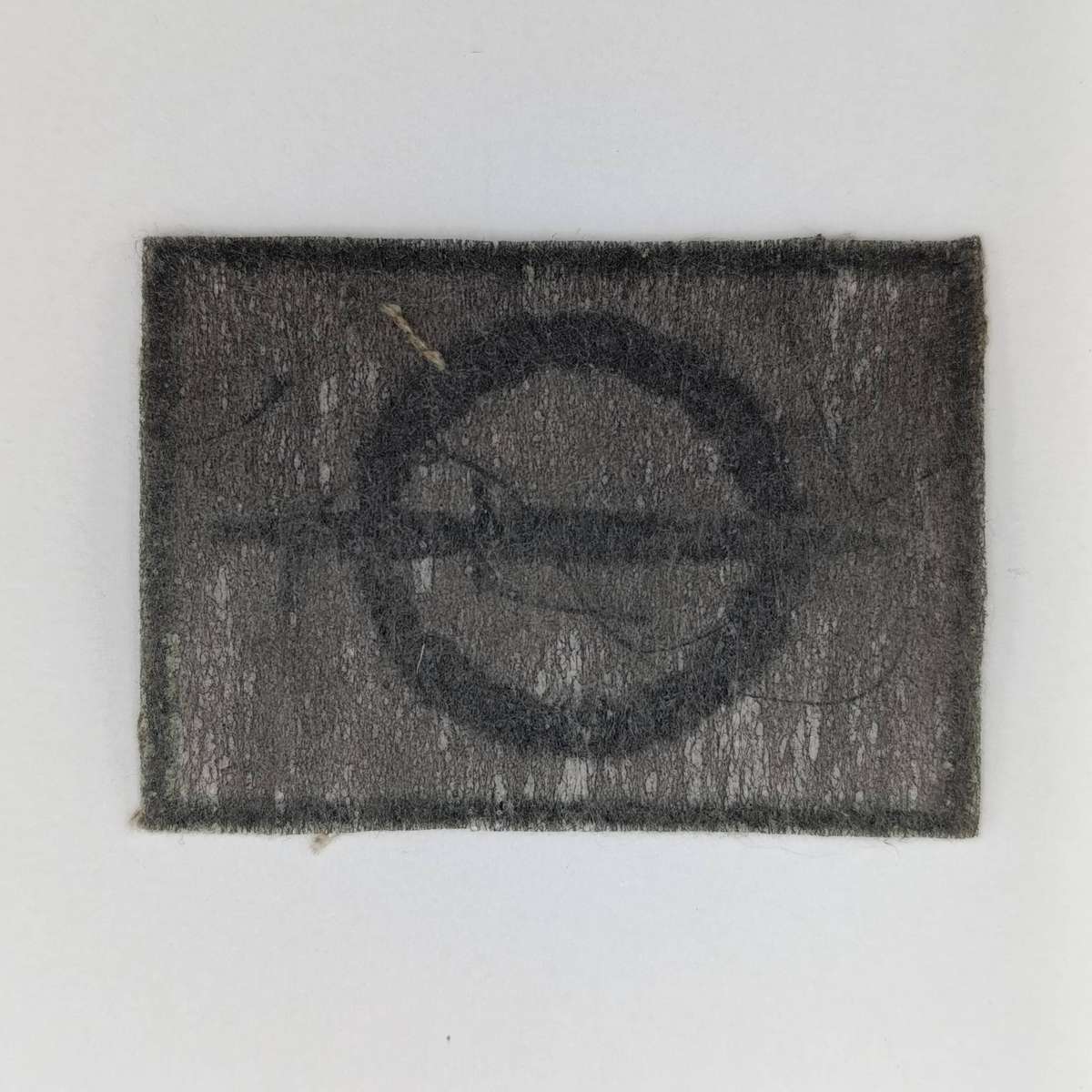 SANDF Special Forces Operator cloth badge with piece of Maroon stable belt material