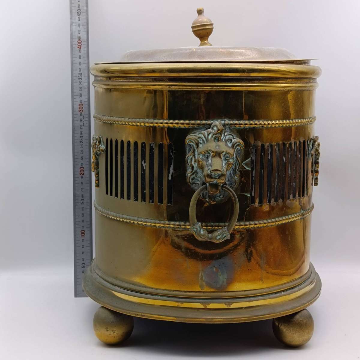 Antique brass coal bucket with lion's head handles