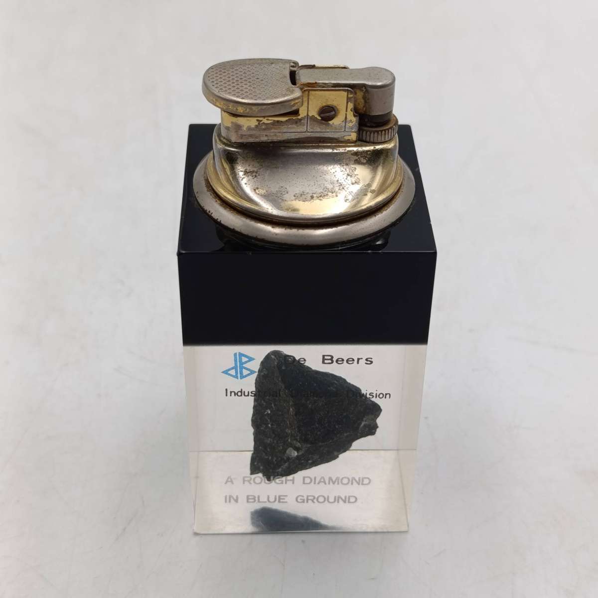 De Beers vintage table lighter with rough diamond in blue ground resin base
