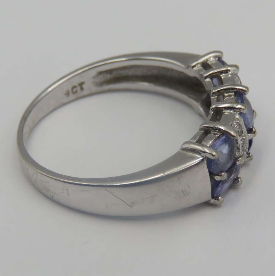 9kt white gold ring with 6 small diamonds and 6 iolites. Weight 3.5g , Size O