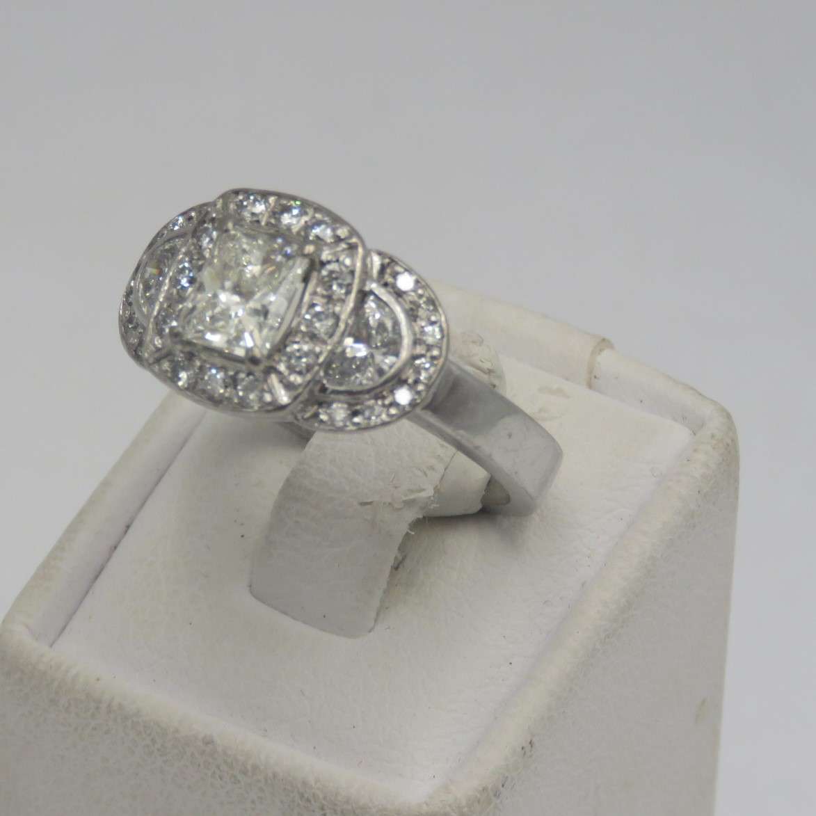 Bespoke 9kt white gold diamond ring with 1,09ct Princess cut diamond with 2 x colour D/E half moon