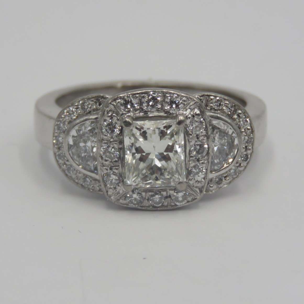 Bespoke 9kt white gold diamond ring with 1,09ct Princess cut diamond with 2 x colour D/E half moon