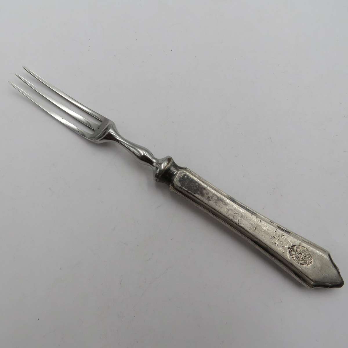 Antique pickle fork with ZAR Transvaal coat of arms on handle.