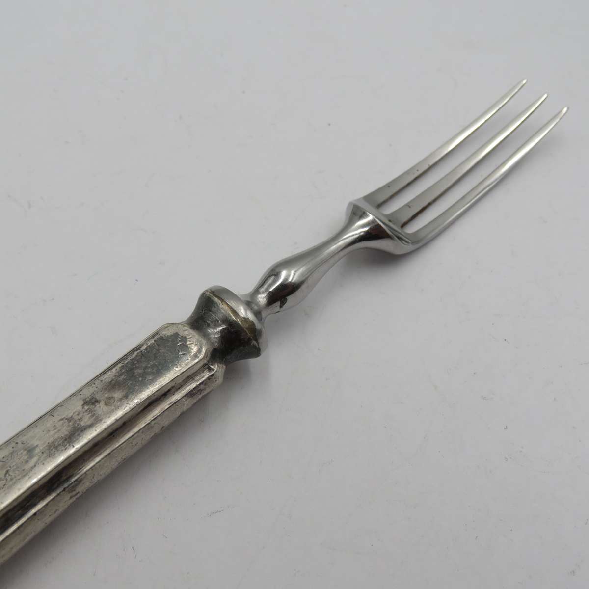 Antique pickle fork with ZAR Transvaal coat of arms on handle.