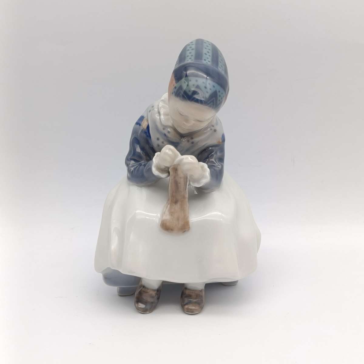 Vintage Royal Copenhagen girl sewing porcelain figurine