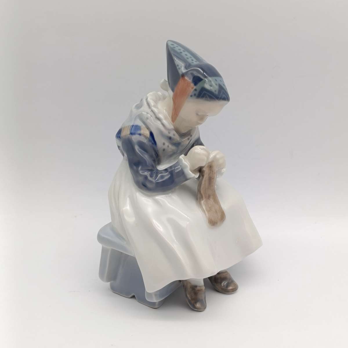 Vintage Royal Copenhagen girl sewing porcelain figurine