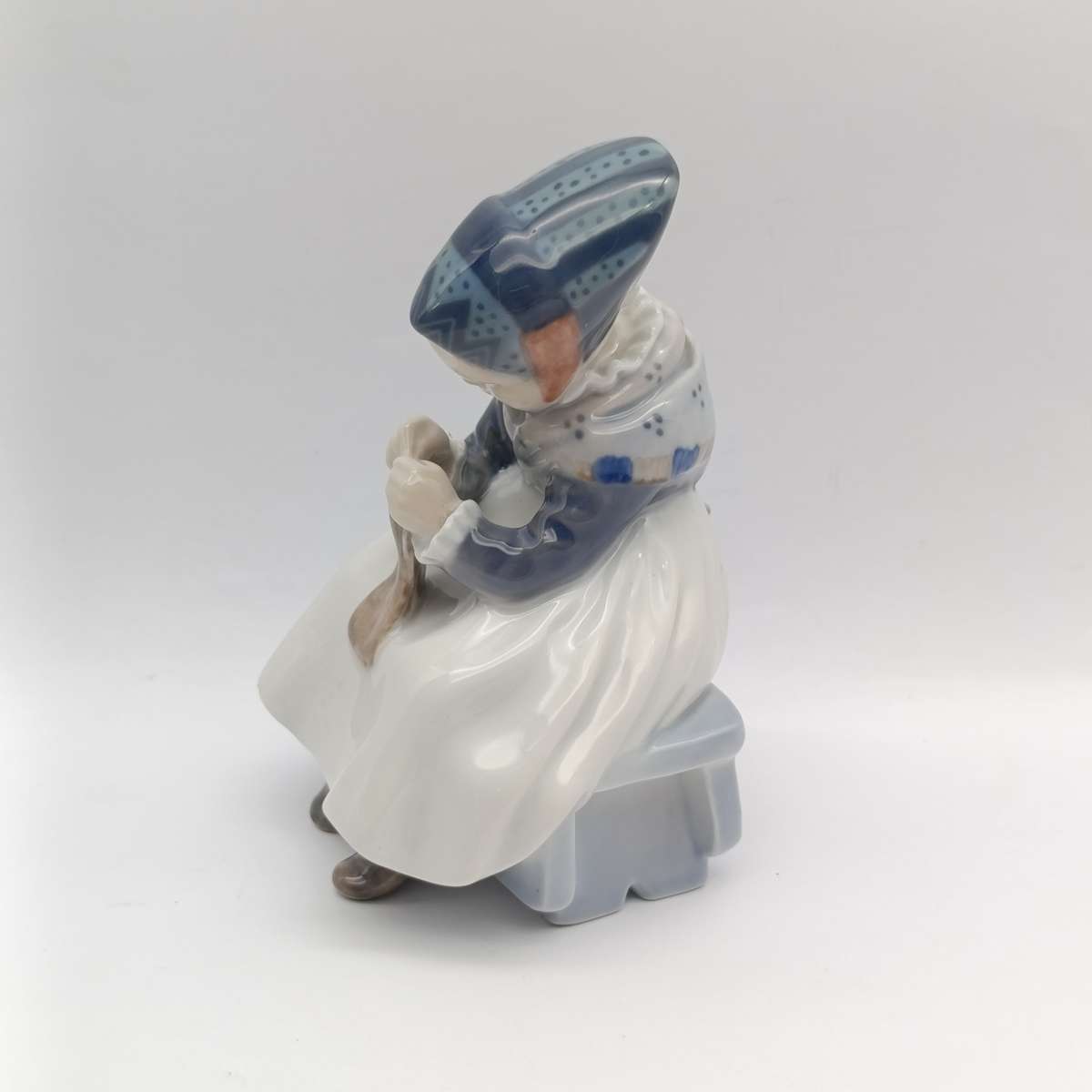 Vintage Royal Copenhagen girl sewing porcelain figurine