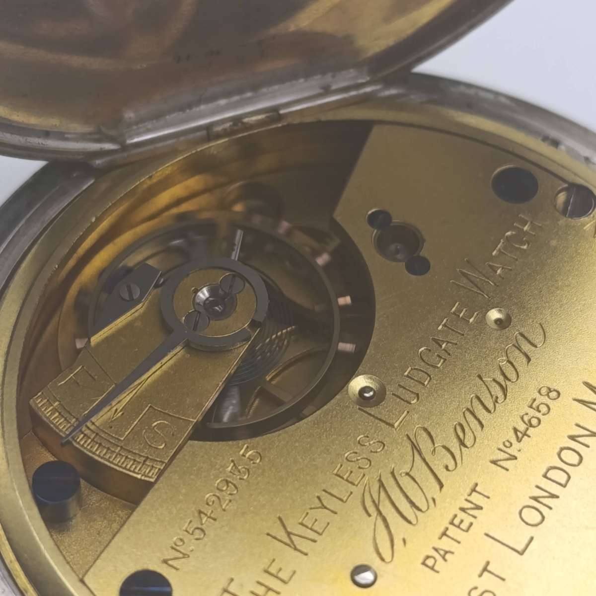 Antique hallmarked silver 1892 half hunter pocketwatch in silver front travelling case - working