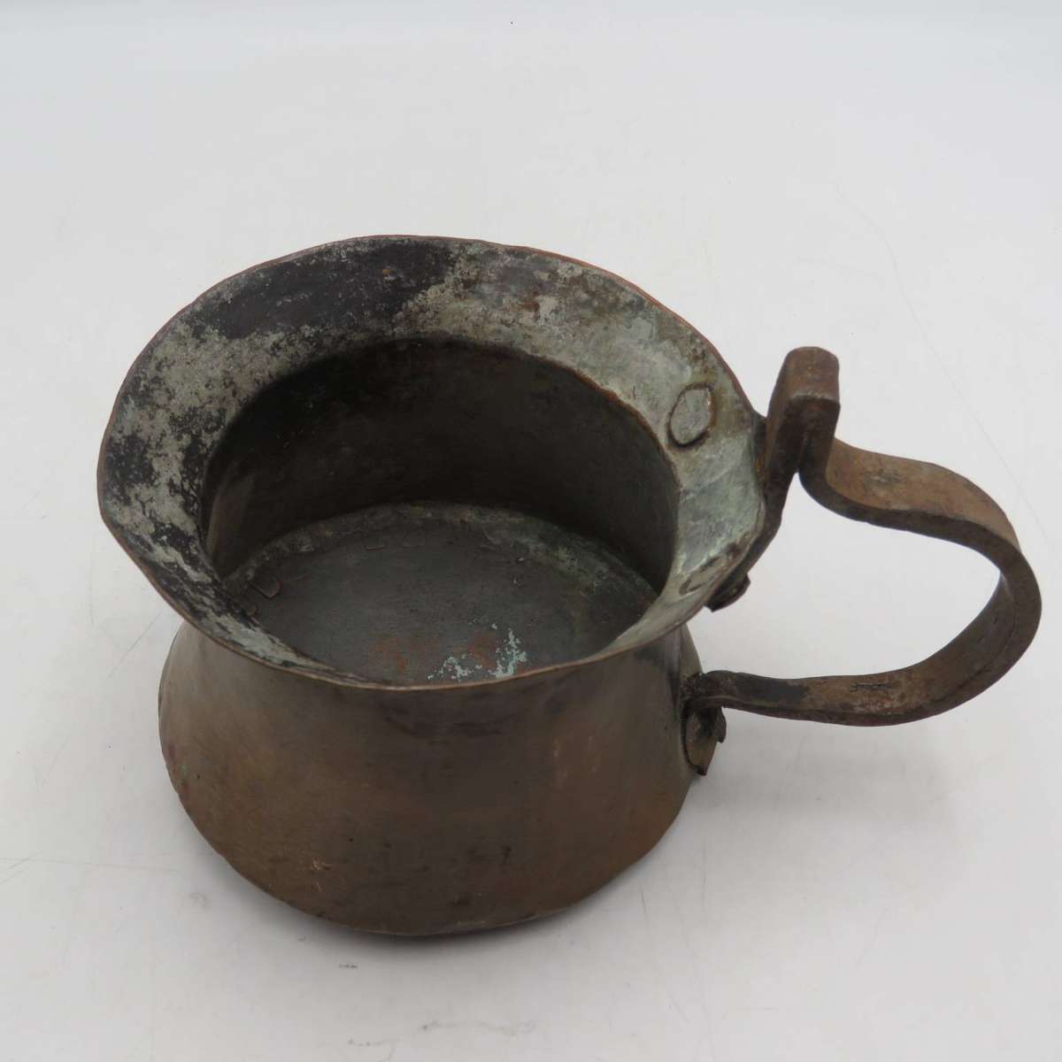 Antique hammered copper coffee pot with iron handle