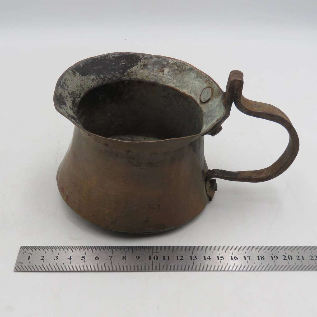Antique hammered copper coffee pot with iron handle