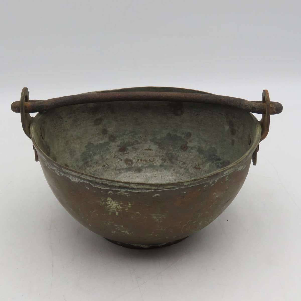 Antique copper bowl with cast iron handle