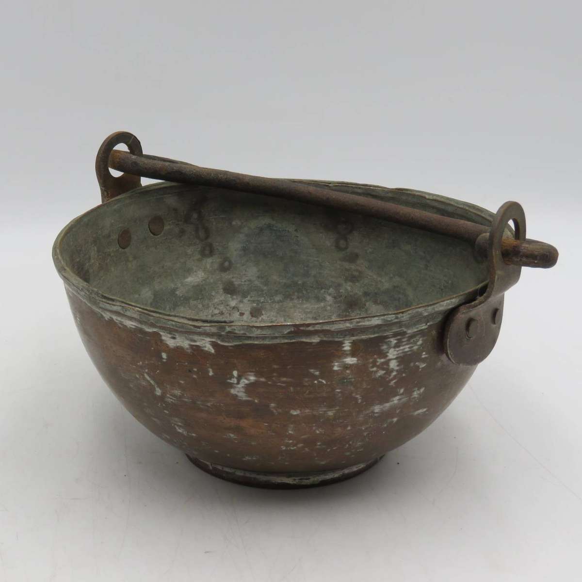 Antique copper bowl with cast iron handle