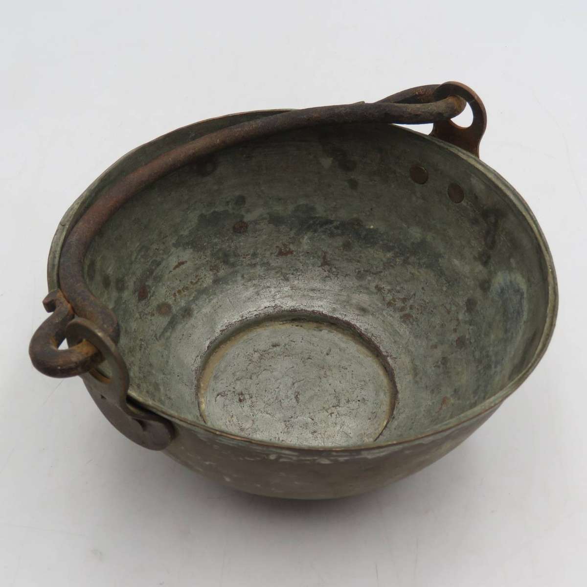 Antique copper bowl with cast iron handle