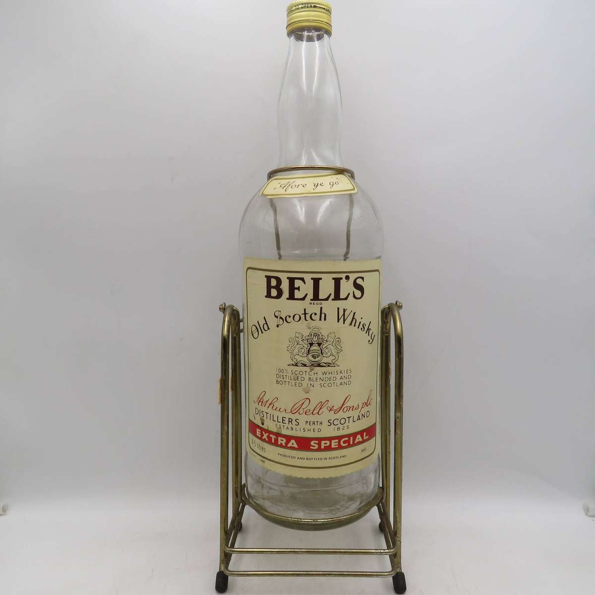 Bell's Scotch Whisky 4.5lt glass bottle on tipping stand - Empty