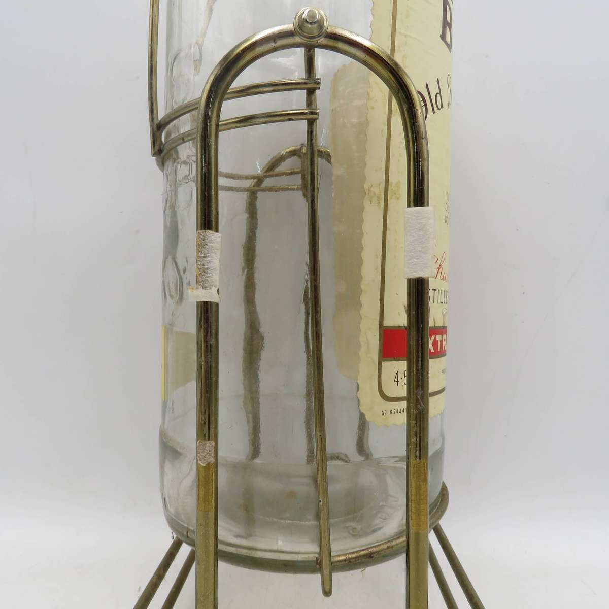 Bell's Scotch Whisky 4.5lt glass bottle on tipping stand - Empty