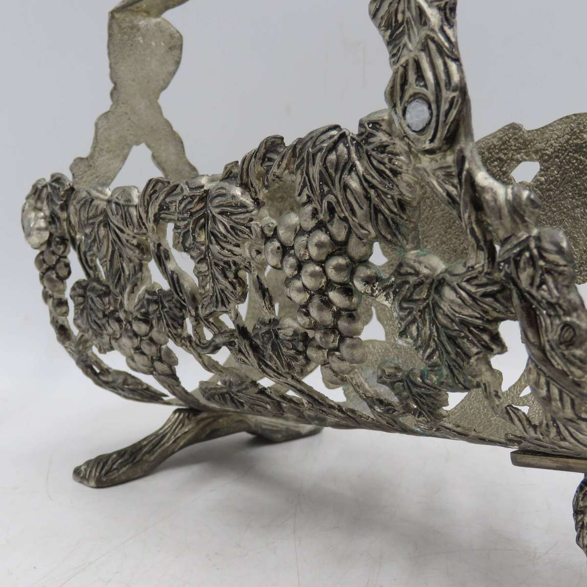 Vintage silverplated vintner motif wine bottle stand